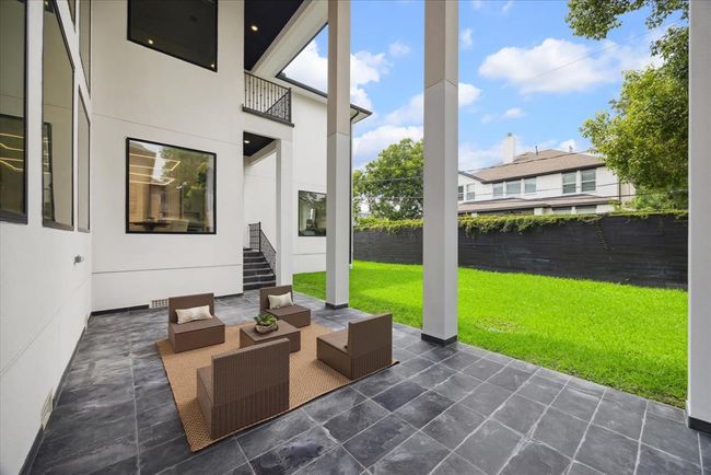 VERANDA: Designed with contemporary elegance, the veranda features sleek lines and minimalist aesthetics that complement the home's architecture. It provides a tranquil retreat where you can unwind with a morning coffee or host gatherings with friends and family. | Image 46