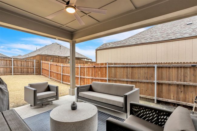 View of patio / terrace featuring a fenced backyard, an outdoor hangout area, and ceiling fan | Image 24