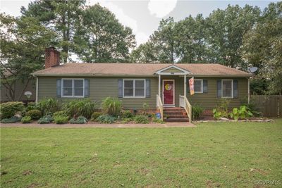 Ranch-style home featuring a front lawn | Image 1