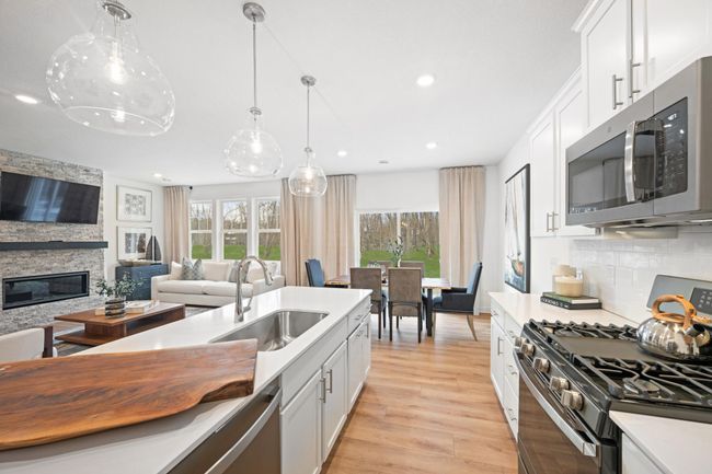 Photo is of the actual model. Just off the kitchen is the dining area. | Image 4