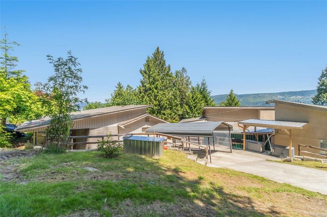 View of yard featuring an outdoor structure | Image 74