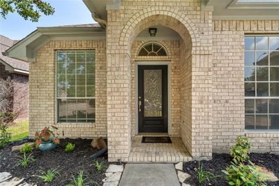 This beautiful front door welcomes your guests with style. | Image 2