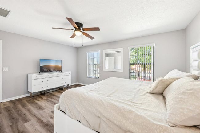 Primary Bedroom Large Windows Give a Bright Airy Feel | Image 18