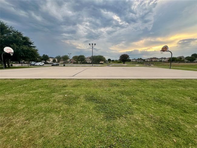 View of sport court with community basketball court and a yard | Image 36