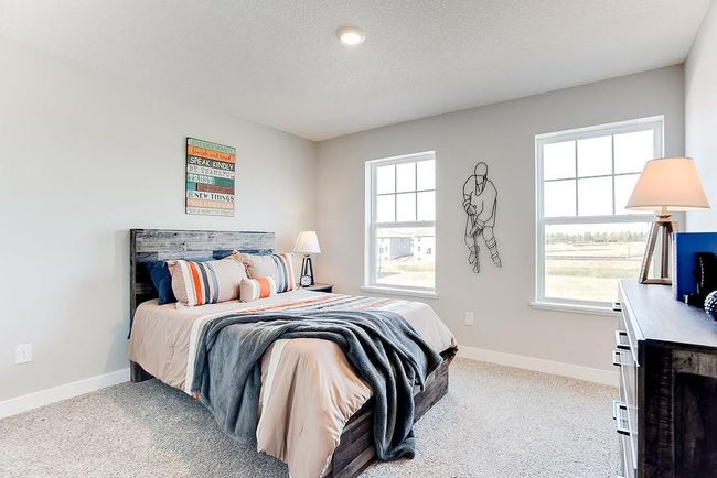 Another large upper level bedroom. Photo of model home, color & options will vary. | Image 17