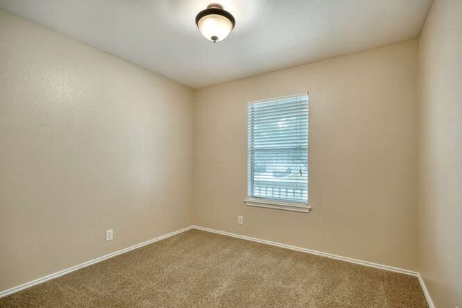 Carpeted spare room featuring baseboards | Image 9