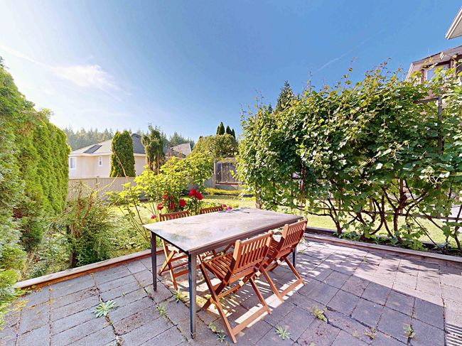 Fenced backyard featuring a patio area and outdoor dining area | Image 36