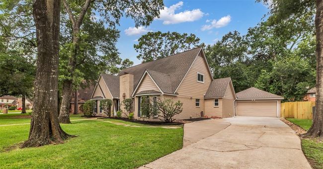 A long private driveway provides access to the detached garage, which includes an office, flex space, or additional room. | Image 41