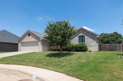 View of front facade featuring a garage and a front yard | Image 2