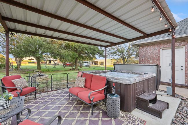 View of patio with a hot tub | Image 7