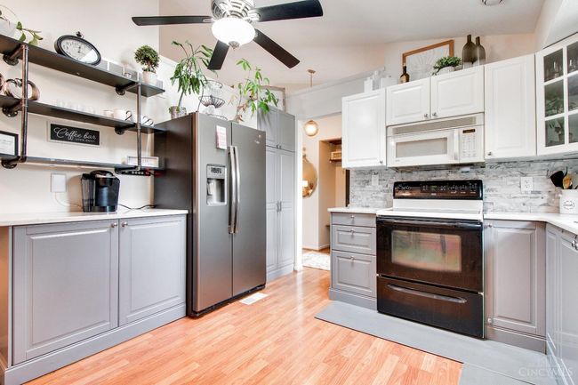 The kitchen has everything you need to cook a meal, including silverware, dishes and appliances! You will feel right at home here. | Image 9