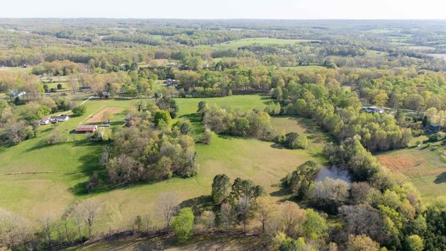 Another view of multiple fields that are a part of this property. NOTE: Aerial Views Show Adjoining Properties Not Included in Sale | Image 4