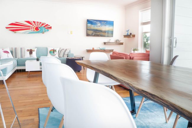 Dining room with ornamental molding and light wood-type flooring | Image 7