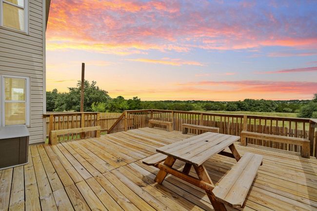 Deck at dusk with outdoor dining area | Image 37