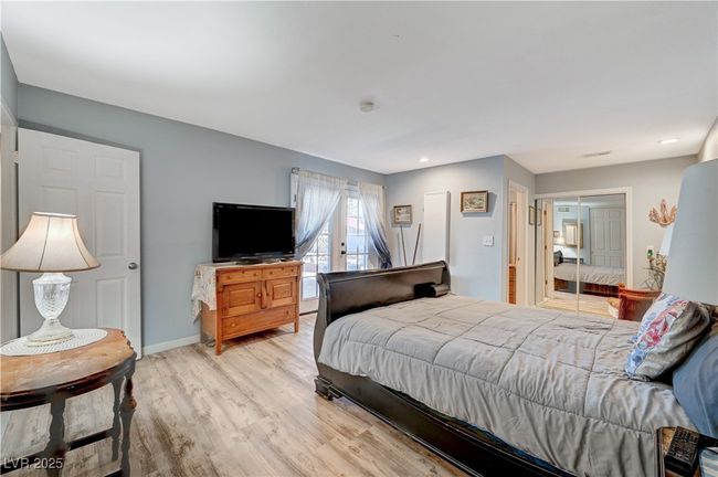 Bedroom featuring light wood-style flooring, baseboards, a closet, and recessed lighting | Image 47