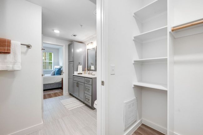 Ensuite bathroom featuring vanity, baseboards, and toilet | Image 17