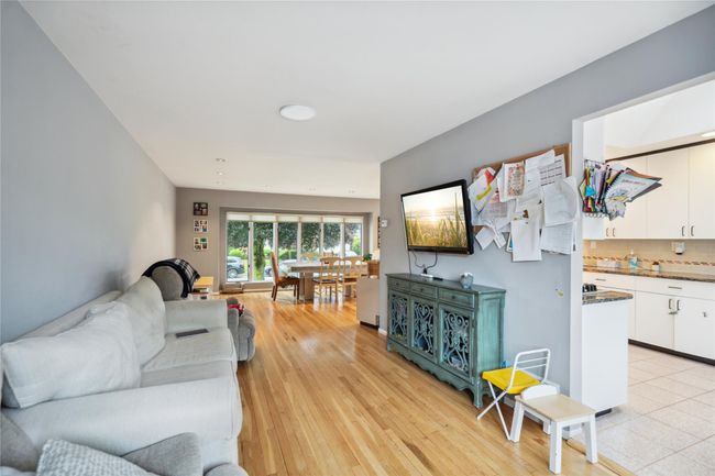 Living area with light wood-style flooring | Image 5