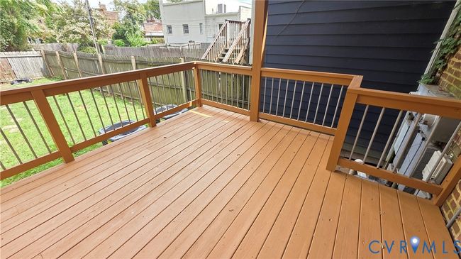 Deck with a fenced backyard | Image 11
