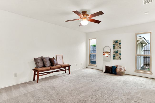 Primary Bedroom featuring carpet and a ceiling fan | Image 22