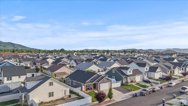 Aerial perspective of suburban area featuring a mountainous background | Image 31