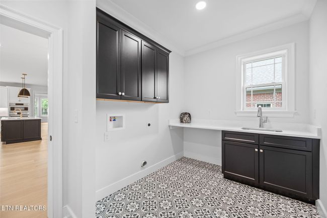 Spacious Laundry Room Located Near Garage | Image 30