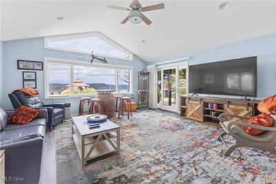 Living room with high ceiling and ceiling fan | Image 2