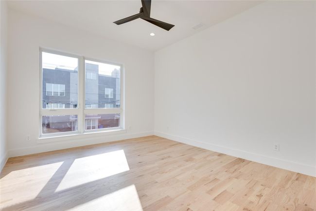 Empty room featuring light hardwood / wood-style flooring and ceiling fan | Image 31