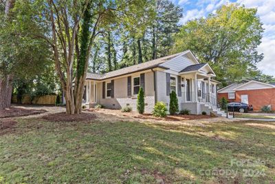 Exterior Phot showing Greenbrook unit on the left and Woodhill unit on the right. All new roof, windows, gutters and freshly painted, as well as new landscaping. | Image 1