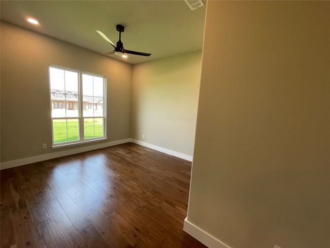 Spare room with ceiling fan, dark wood finished floors, and recessed lighting | Image 28