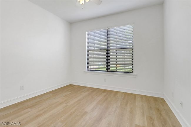 Empty room featuring wood finished floors, a ceiling fan, and baseboards | Image 12