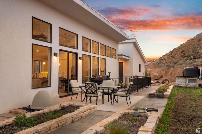 Patio terrace at dusk featuring area for grilling | Image 62