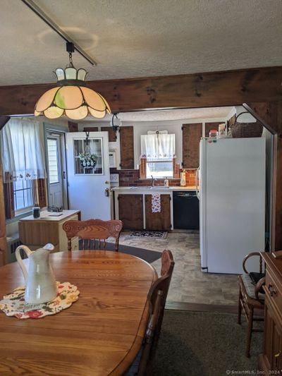 Dining area open to kitchen | Image 2