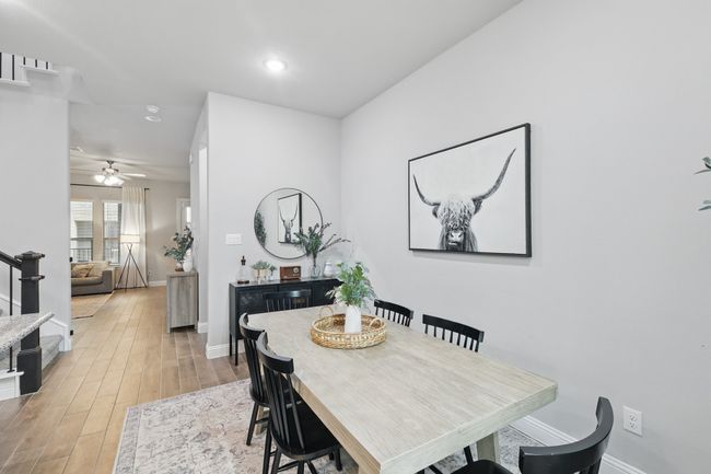 Dining space with baseboards, light wood-type flooring, a ceiling fan, and recessed lighting | Image 5