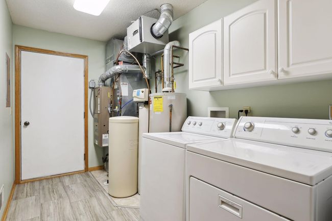 Laundry and utility room is situated just off of the garage. | Image 24