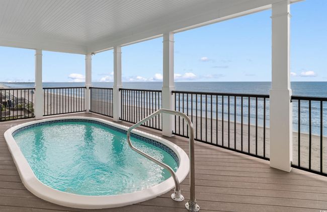 Swimming pool featuring Ocean and Beach views | Image 7
