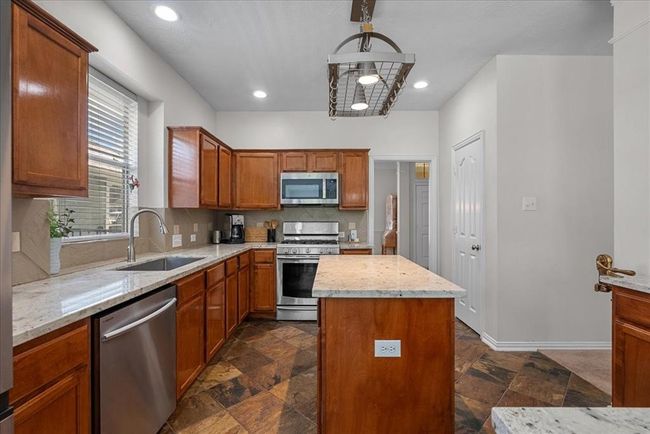 Convenient access to the formal dining room just off the kitchen. | Image 9