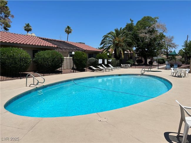 Community pool with a patio | Image 43