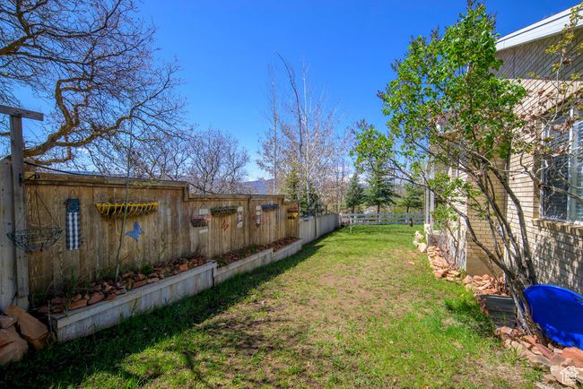 View of yard featuring fence | Image 57