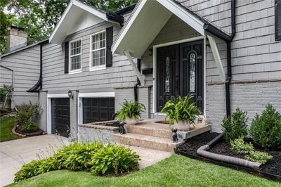 Split foyer home with coveted two car garage featuring new exterior paint ('23) & newer landscaping | Image 2