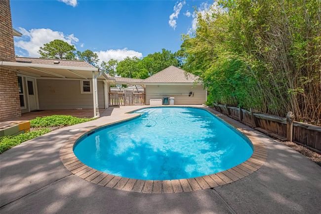 Beautiful pool area offers plenty of of space for multiple uses. | Image 40