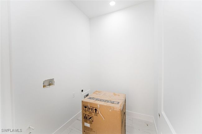Washroom featuring hookup for an electric dryer and hookup for a washing machine | Image 16