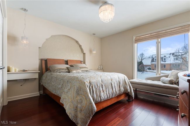 View of bedroom 2 with hardwood flooring and stunning natural light. | Image 28