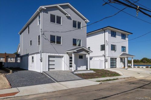 12 Pershing Pl, Island Park, NY, 11558-1407 | Card Image