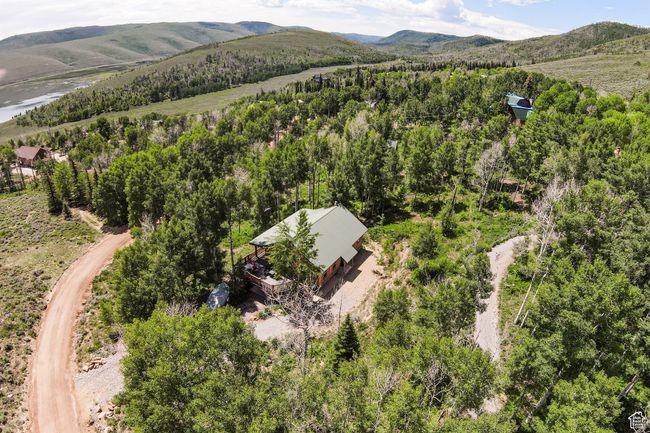 Bird's eye view of a mountain backdrop and a heavily wooded area | Image 39