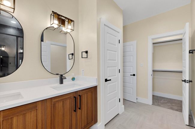Bathroom featuring double vanity | Image 11