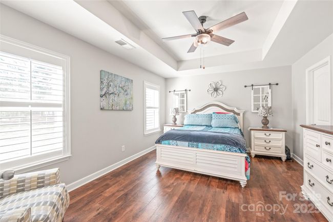 Primary bedroom on the main floor with tray ceiling | Image 9