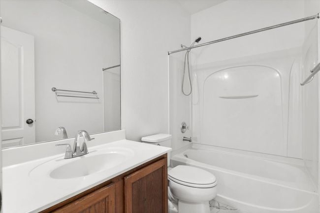 Bathroom with vanity and shower / bath combination | Image 19