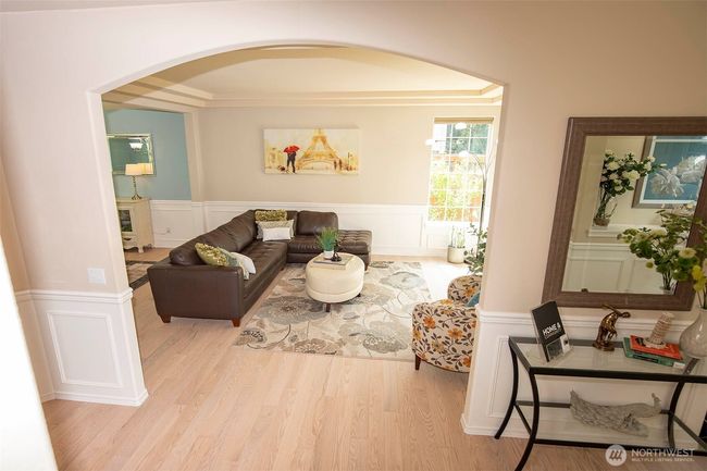 Entrance through Arched Opening to Living Room. | Image 4