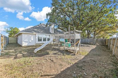 Back of property with a playground | Image 3