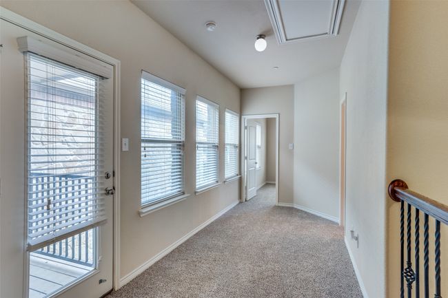 Corridor with carpet and baseboards. Plenty of natural light | Image 14